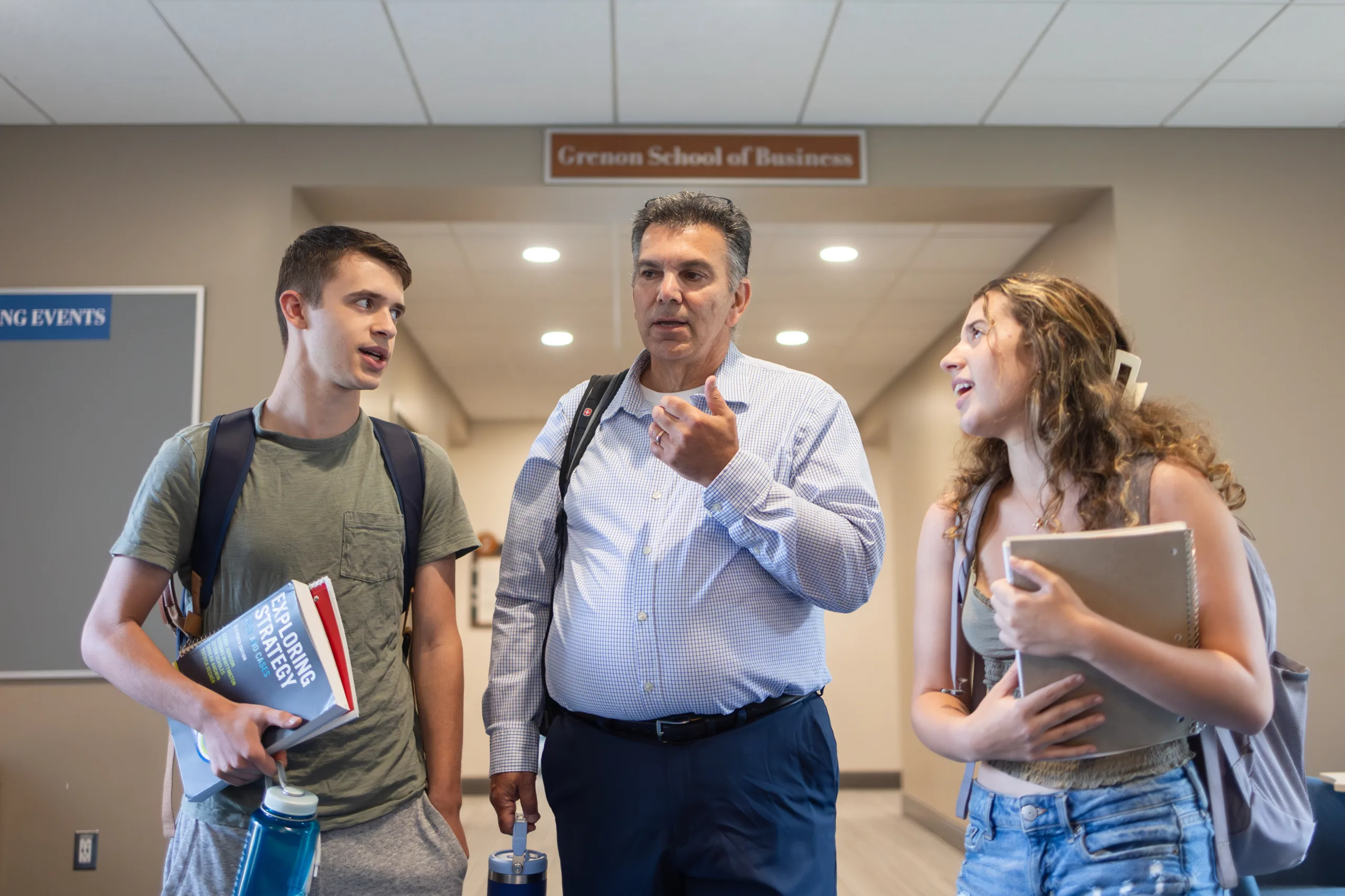 Business professor with students.