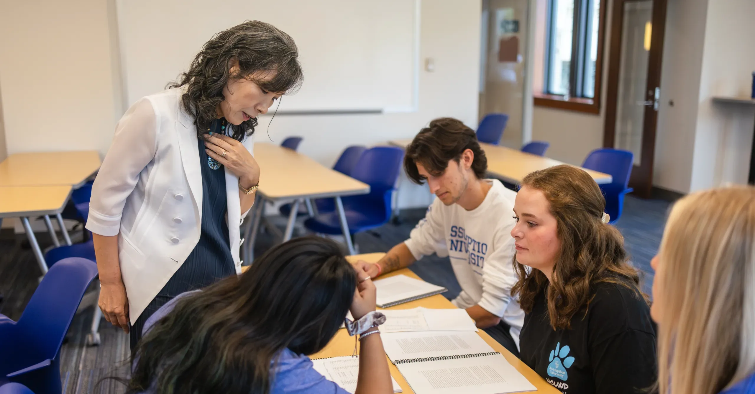 Faculty with a group of students during class