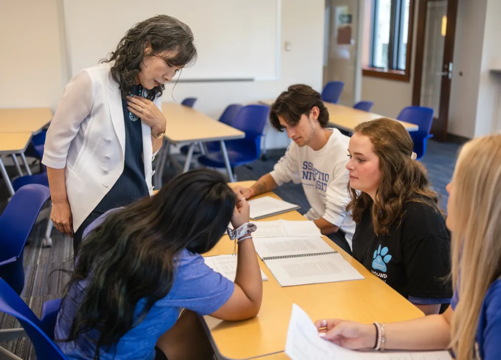 Faculty with a group of students during class